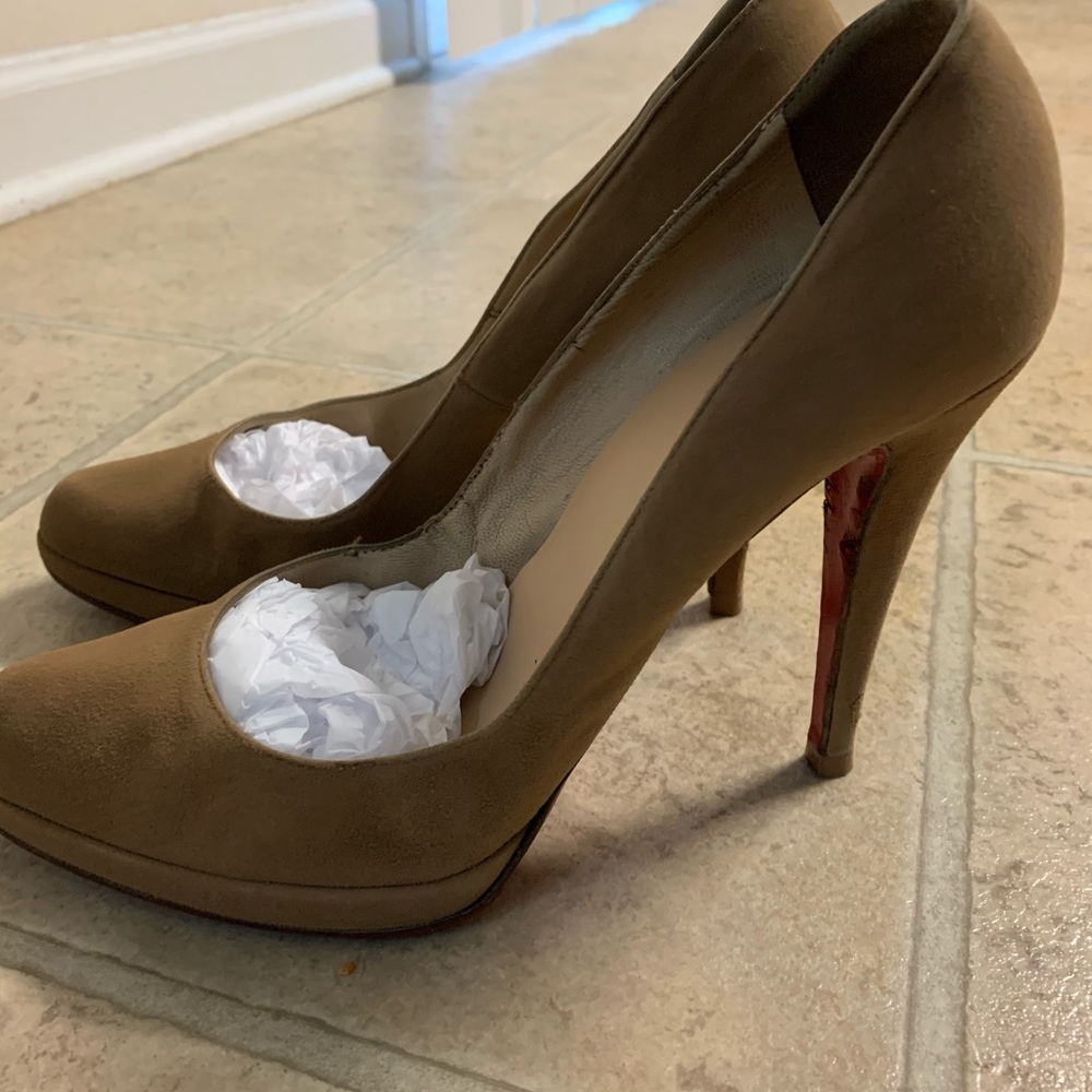 Christian Louboutin beige suede pumps.